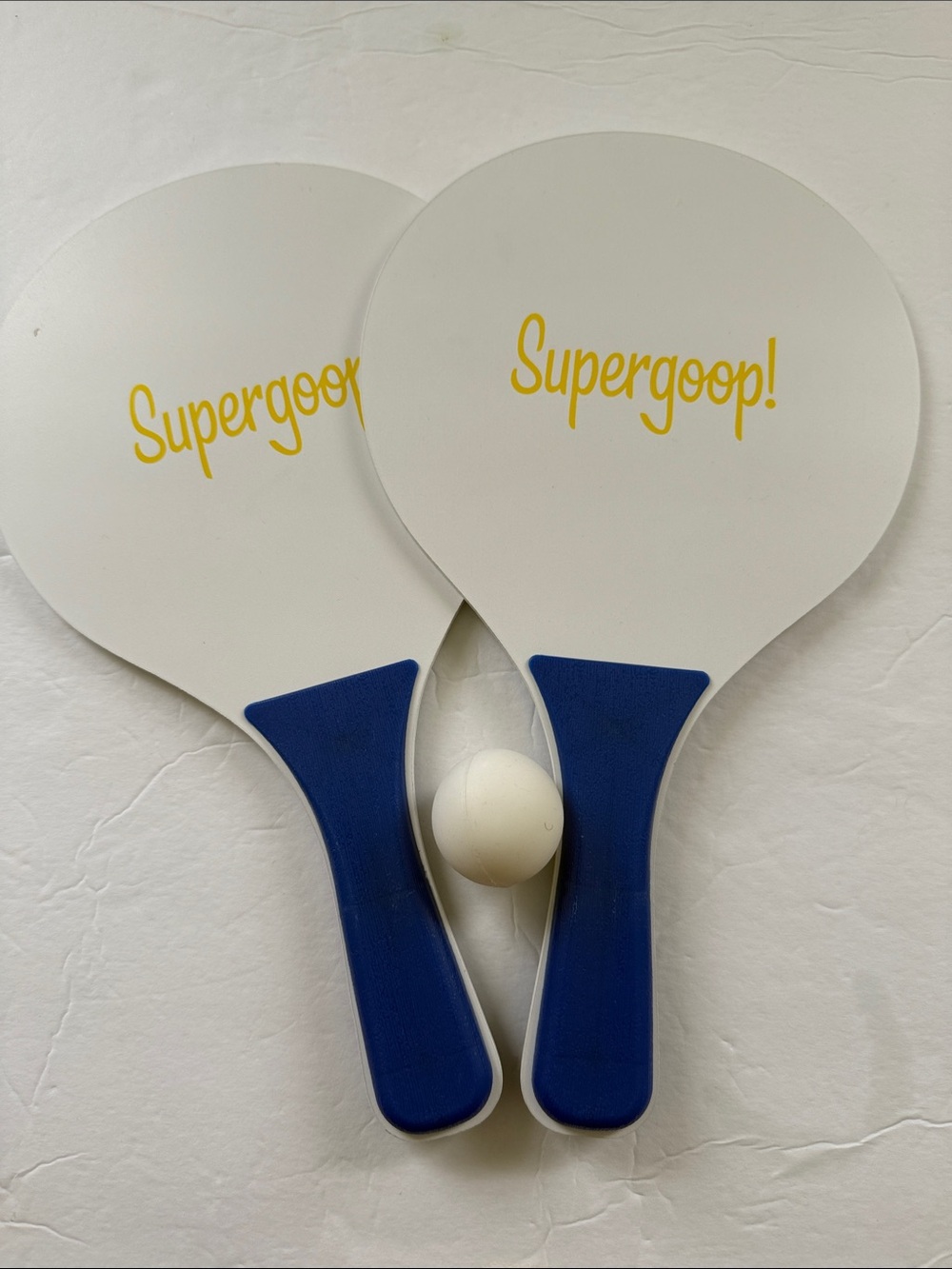 Supergoop! White & Blue Paddleball Set with Yellow Logo